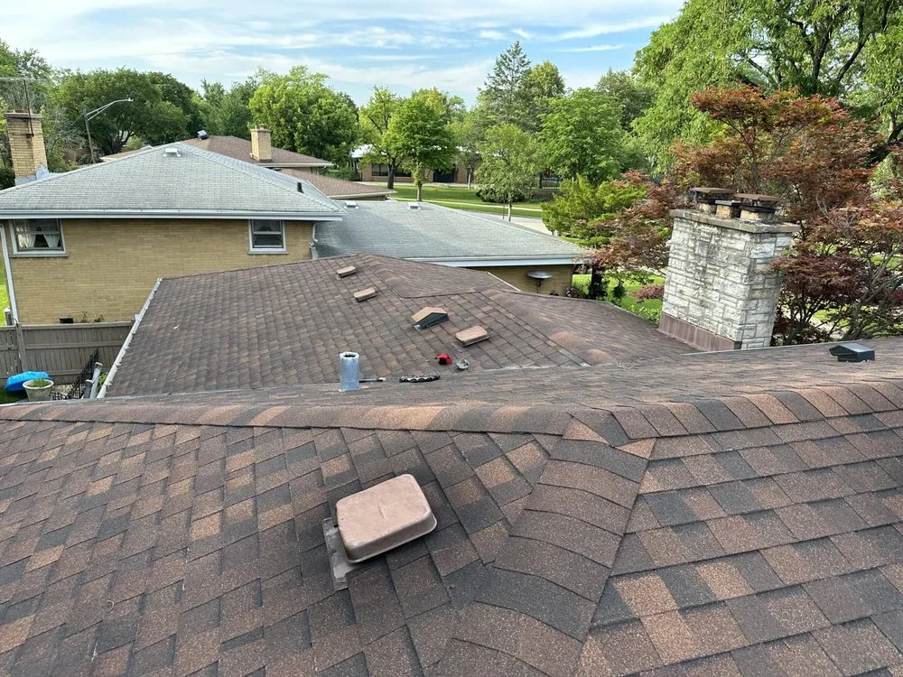 Slide of Stella’s Roofing & Co