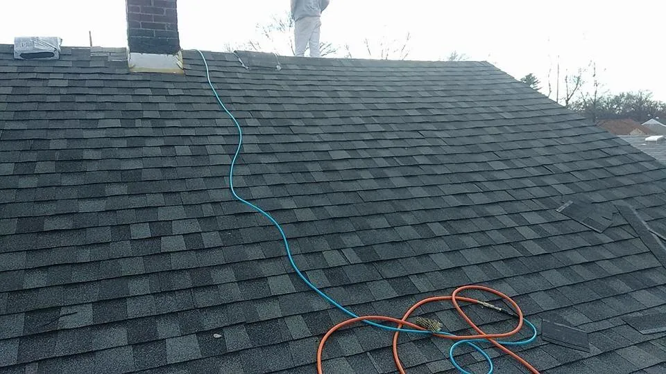 Professional storm damage roof repair in Ofallon, IL by STL Roofing