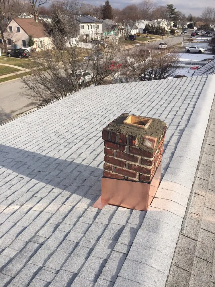 Top-rated roof inspection after storm damage in Flushing, NY by Superior Touch Roofing & Contracting
