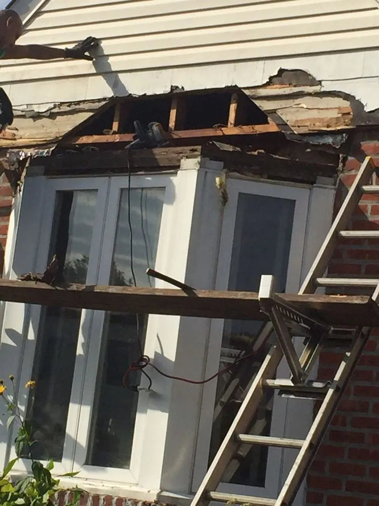 Emergency roof leak repair in Flushing, NY by Superior Touch Roofing & Contracting