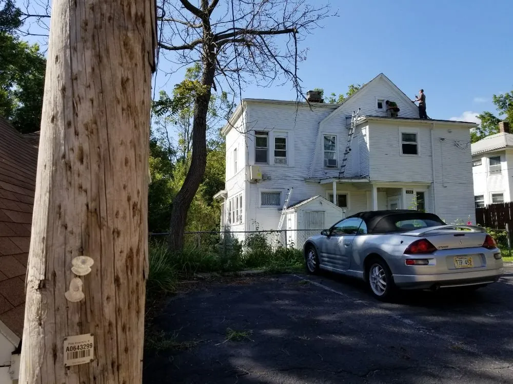 Slide of Synergy Roofing Group