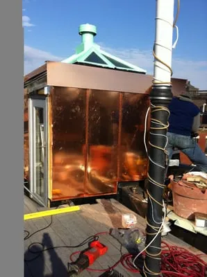 T Morrell Gutters & Roofing Logo