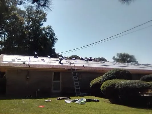 T N T Roofing & Home Improvement Logo