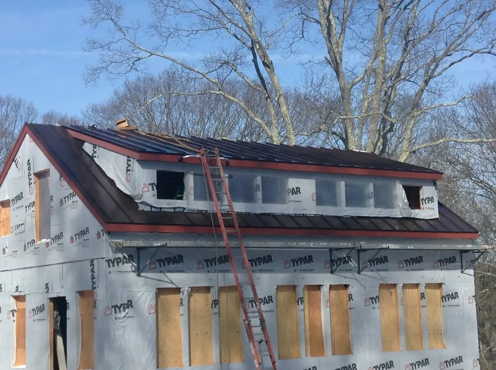 Slide of TA Lema Roofing