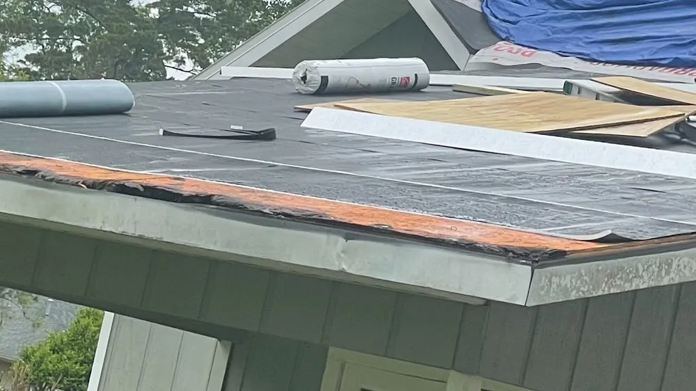 Slide of Tadlock Roofing