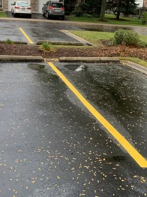 Tan Roofing And Masonry Logo