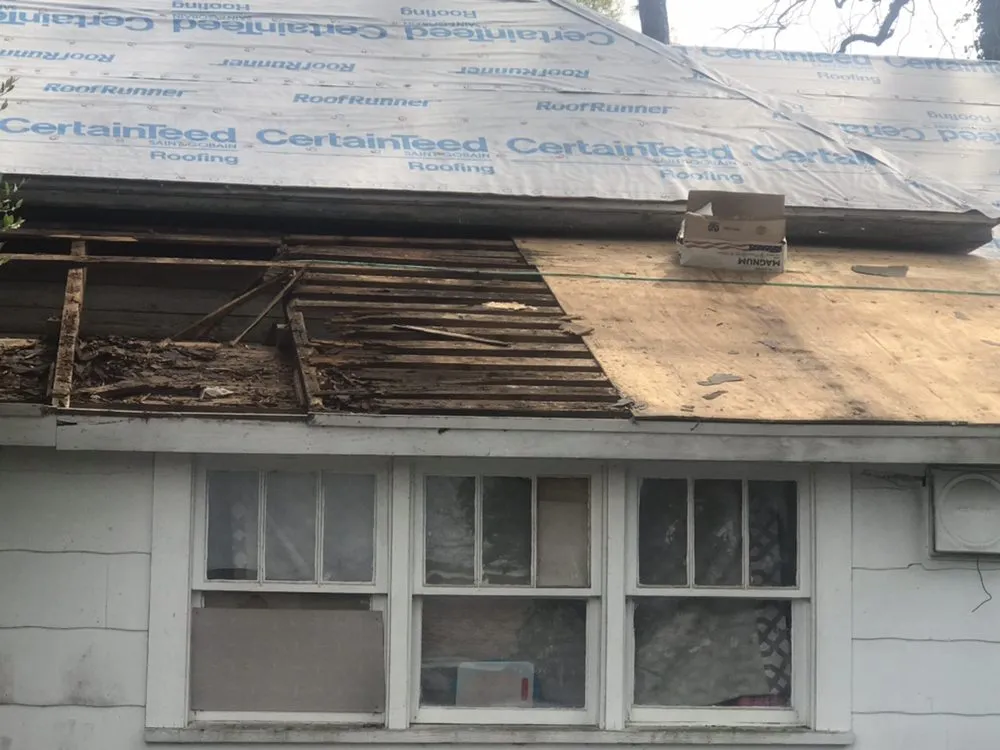 Slide of Tauros Roofing Services