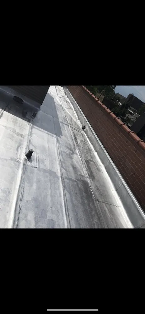 Slide of Tech Roofing and paving