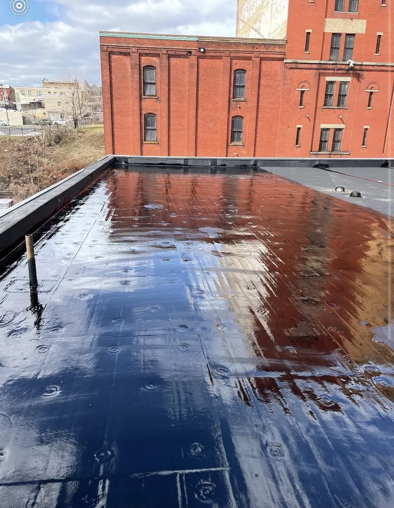 Slide of Tech Roofing and paving