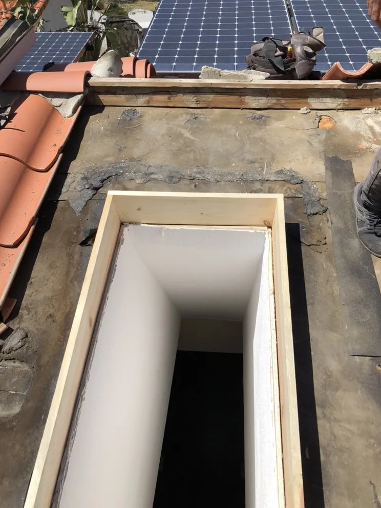 Slide of Tello's Roofing