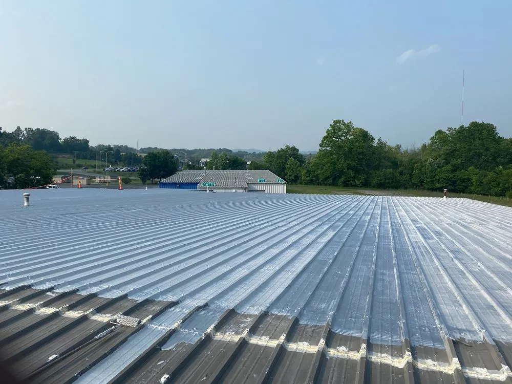 Slide of Teo & Son’s Roofing Company