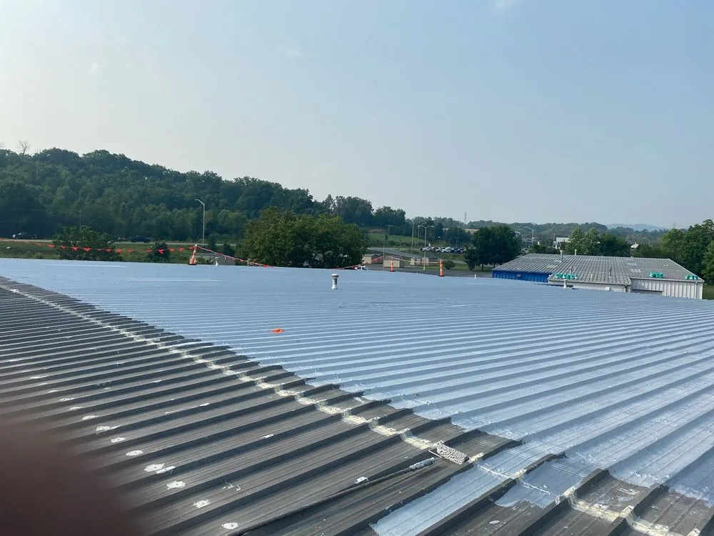 Slide of Teo & Son’s Roofing Company