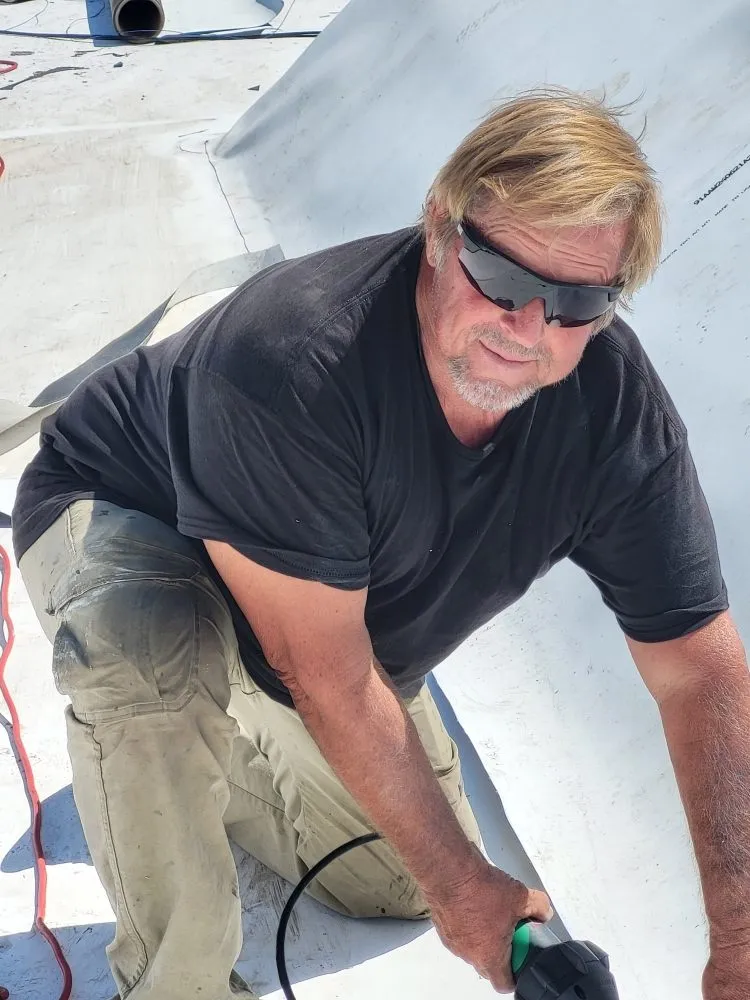 Slide of Terry Ewell the Roofer