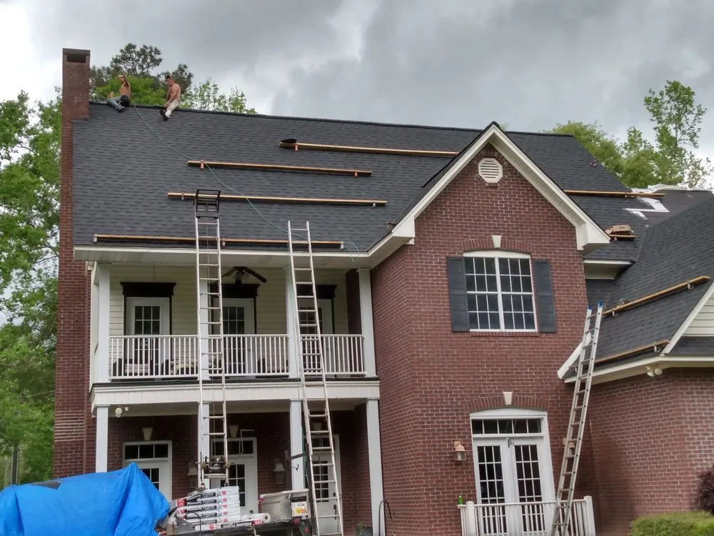 Slide of Tha Roofing company