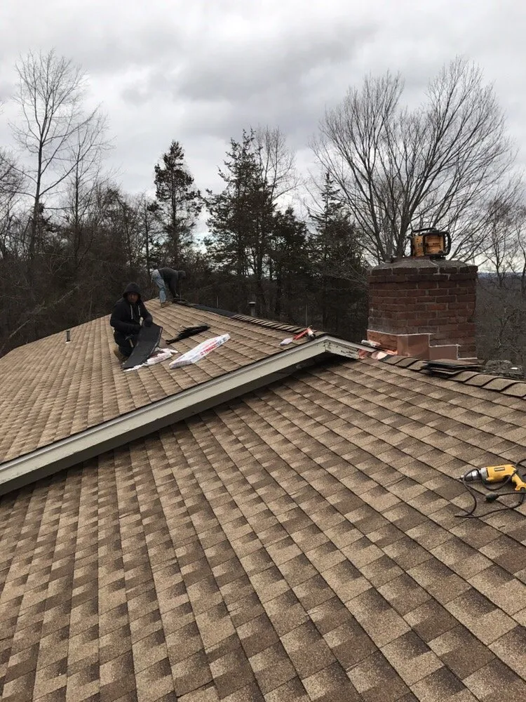 Slide of The Aiello Roofing Company