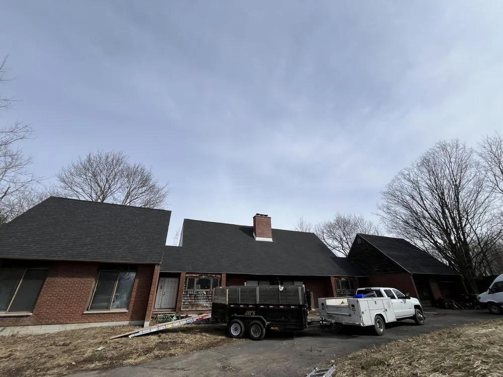 Slide of The Black Goat Roofing And Siding