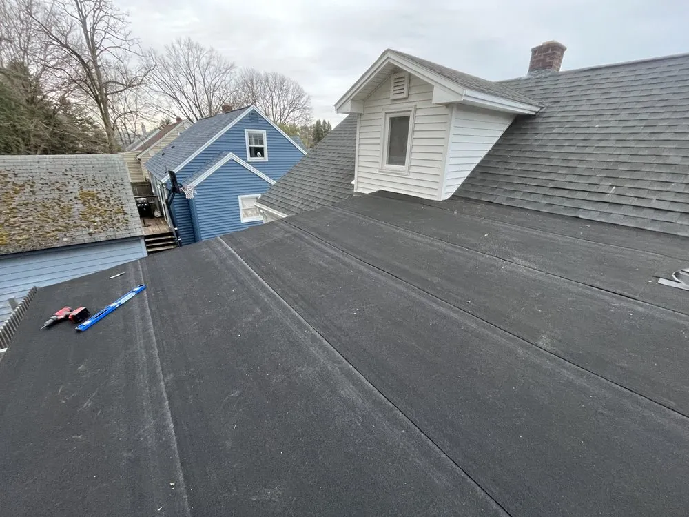 Slide of The Black Goat Roofing And Siding