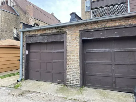 The Flat Roofing Specialist & Tuck Pointing Company Logo