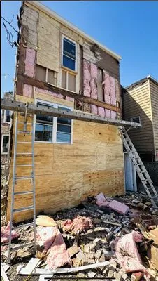 The Power Roofing Construction Logo