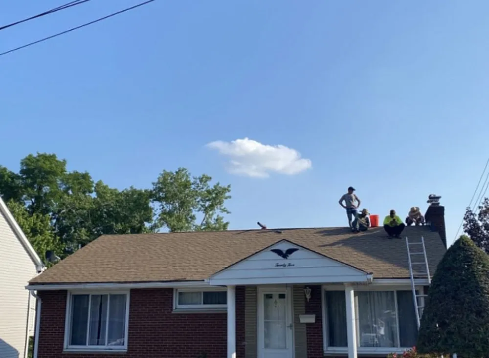 Slide of The Roof & Driveway Experts