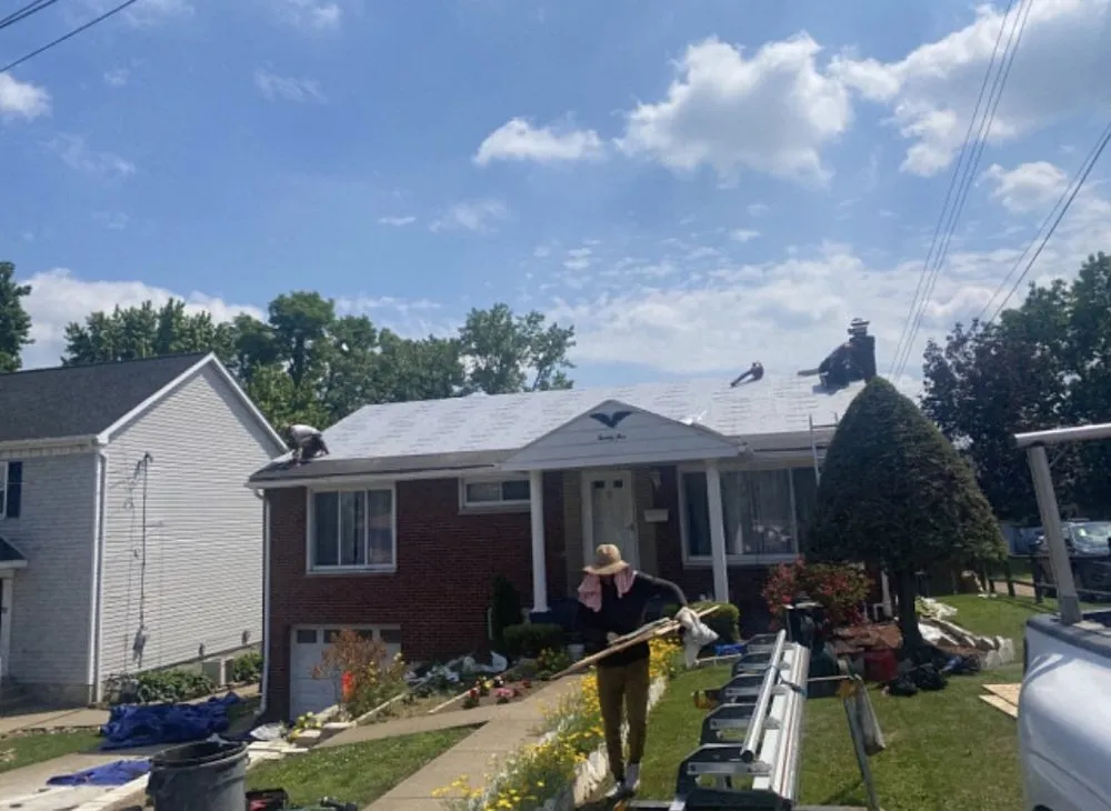 Slide of The Roof & Driveway Experts