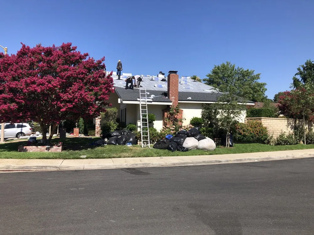 Slide of The Roof Experts