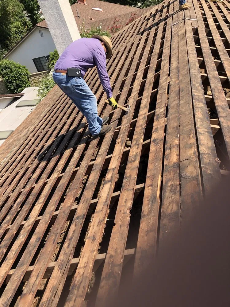 Slide of The Roof Experts