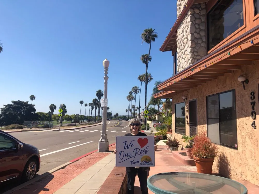 Slide of The Roof Masters