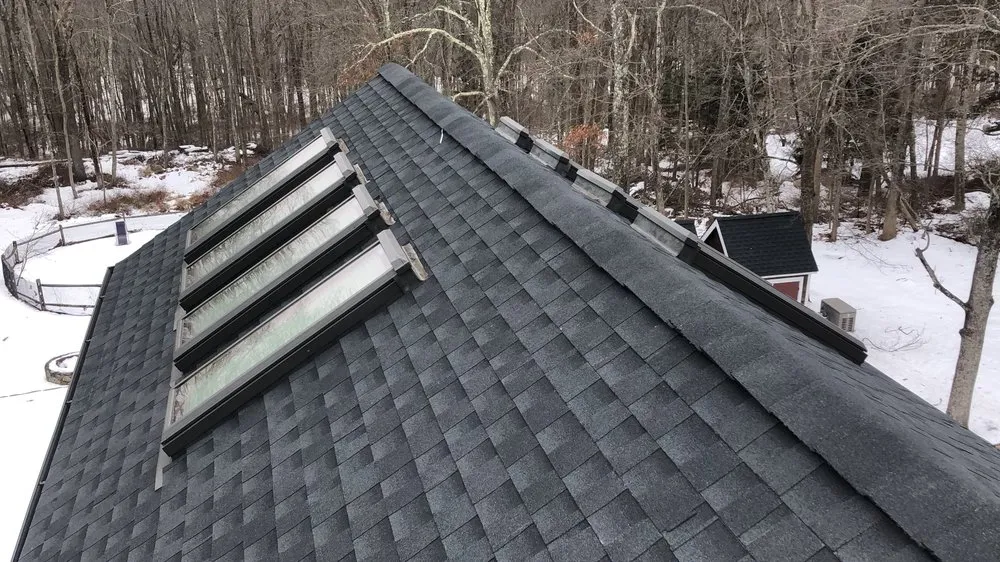 Slide of The Roof Specialist