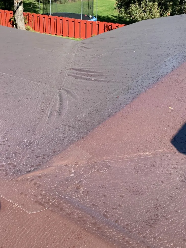 Slide of The Roofing Center