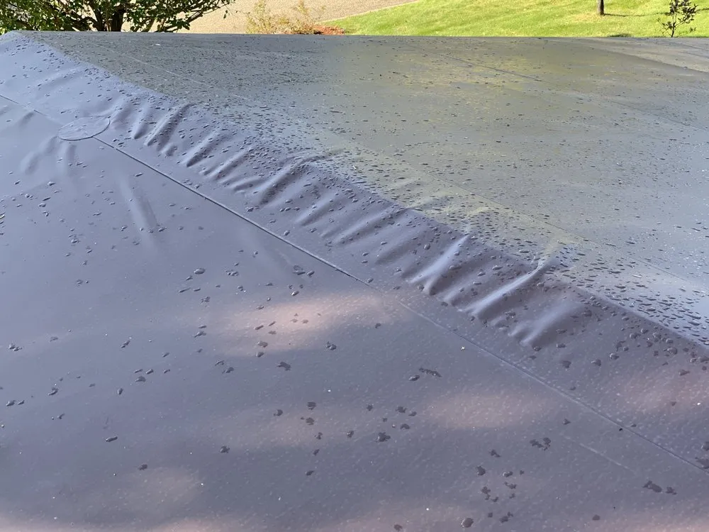 Slide of The Roofing Center