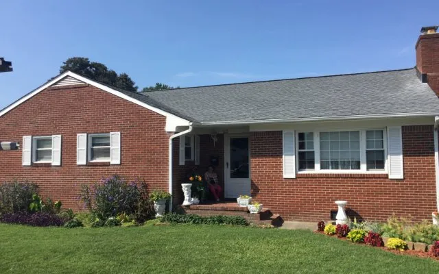 Slide of The Roofing Company