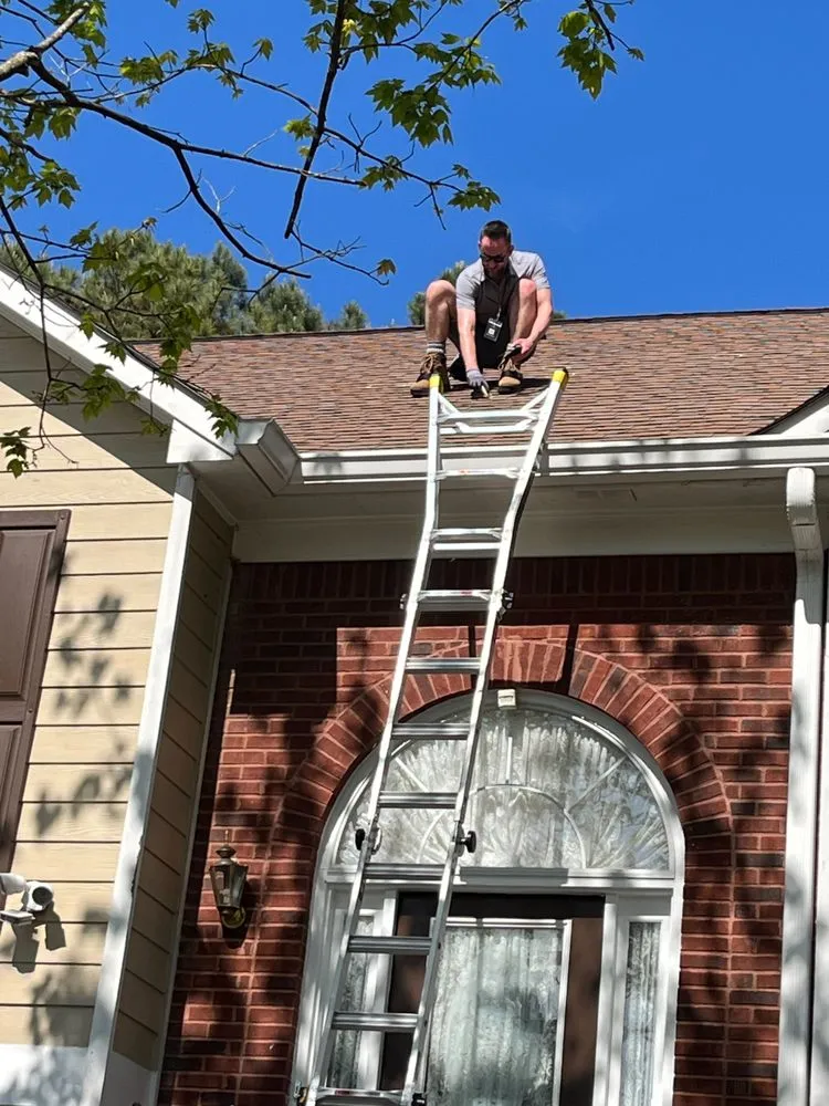 Slide of The Roofing Company