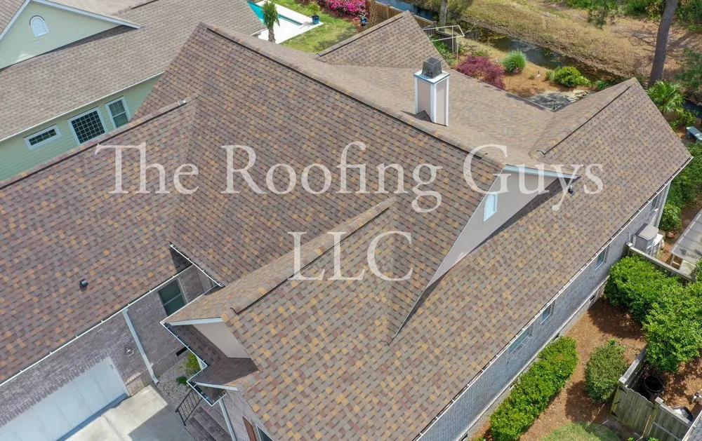 Slide of The Roofing Guys