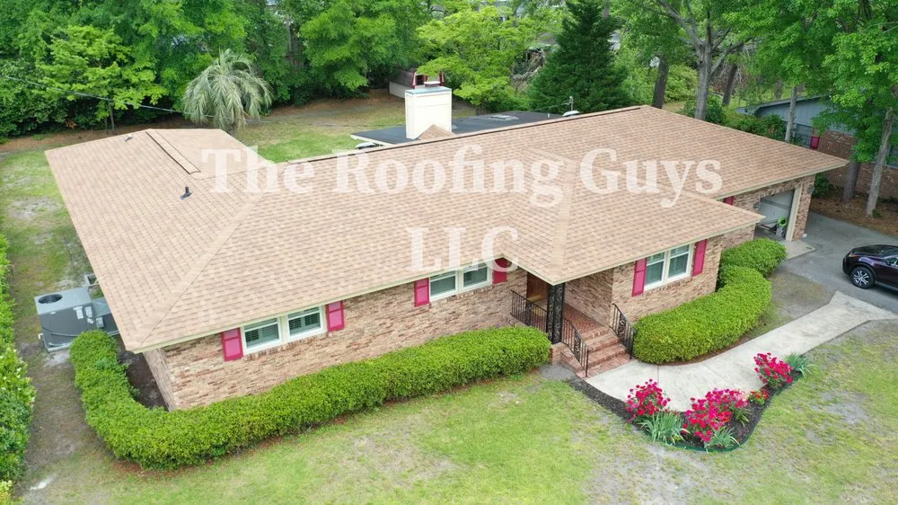Slide of The Roofing Guys