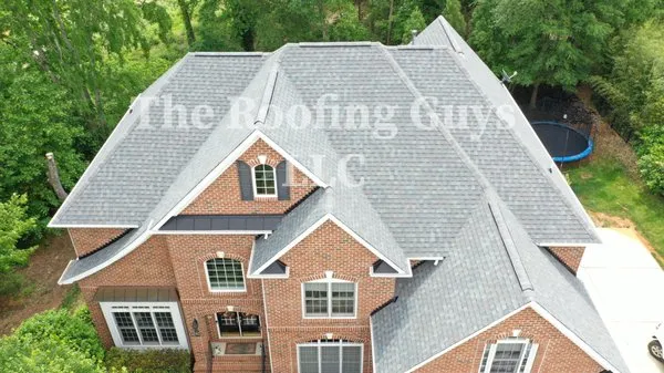 The Roofing Guys Logo