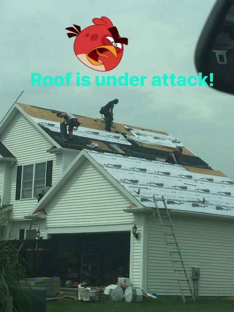 Slide of The Roofing Guys