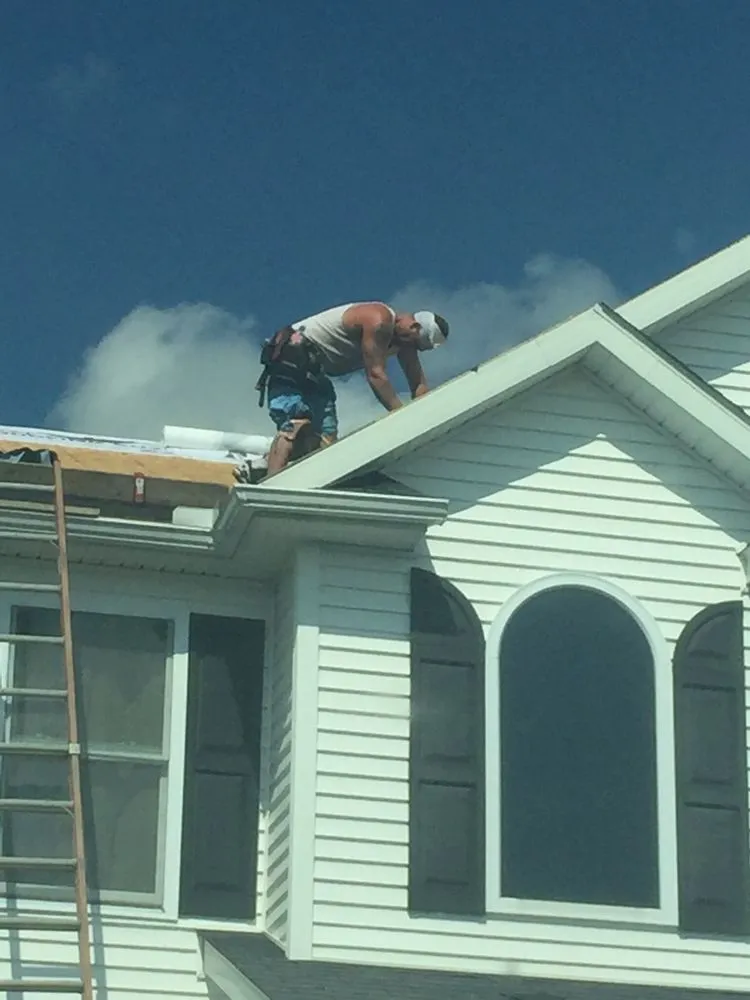 Slide of The Roofing Guys