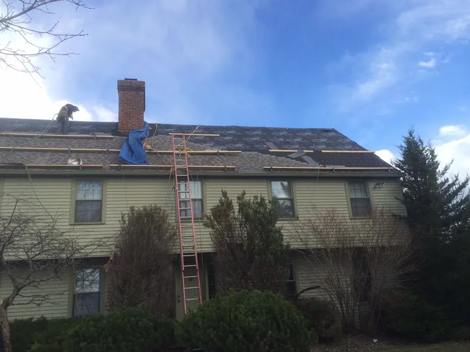 Slide of The Roofing Guys