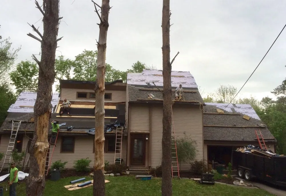 Slide of The Roofing Guys