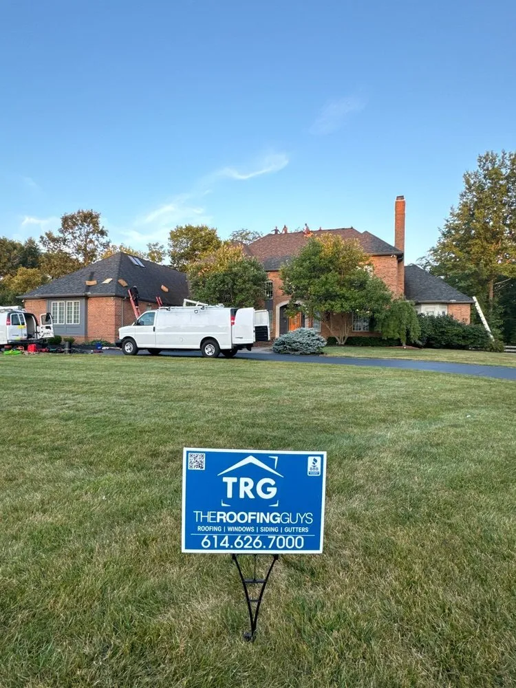 Slide of The Roofing Guys