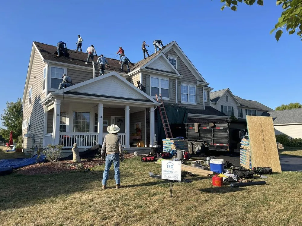 Slide of The Roofing Guys