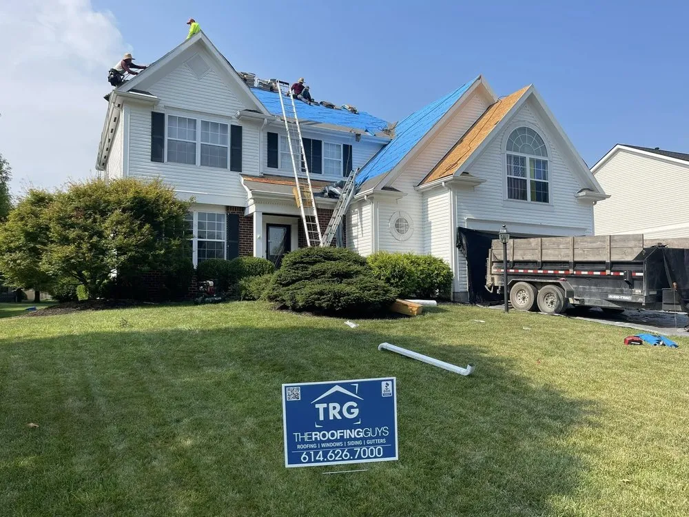 Slide of The Roofing Guys