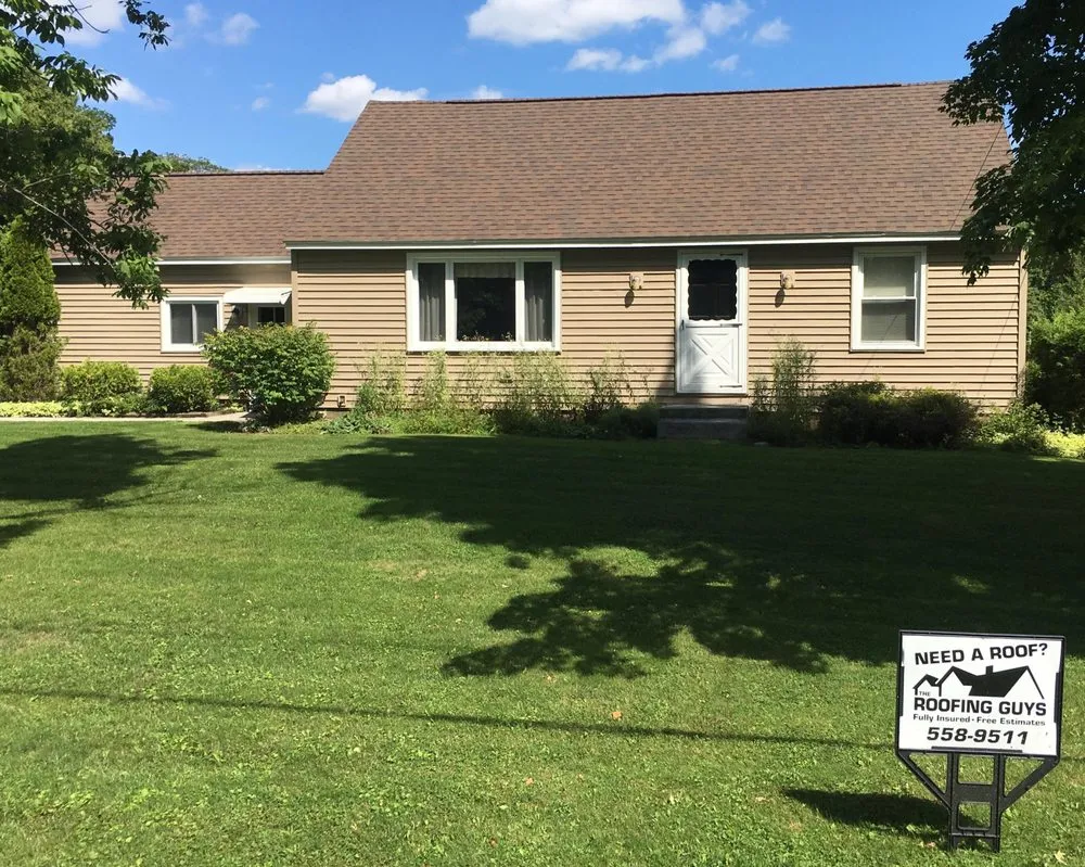 Slide of The Roofing Guys