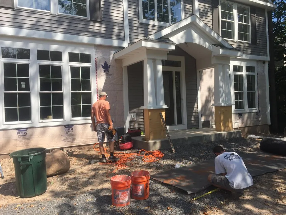 Slide of The Roofing Guys