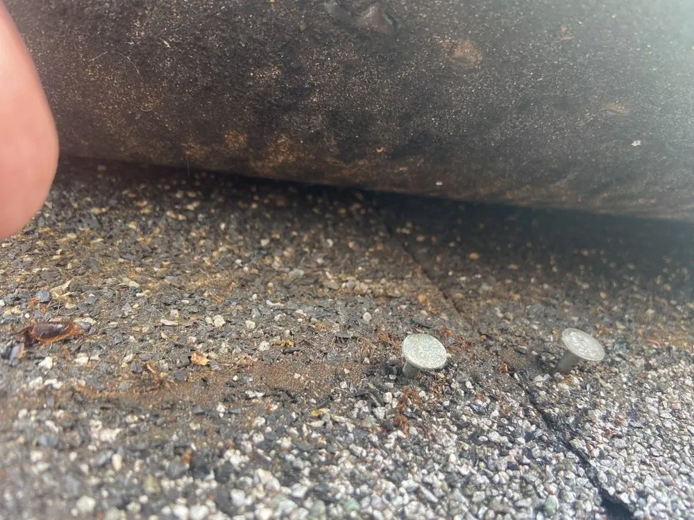 Slide of The Roofing Guys