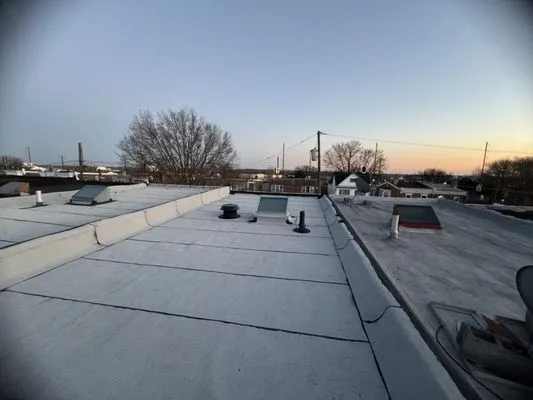 The Roofing Specialists Logo