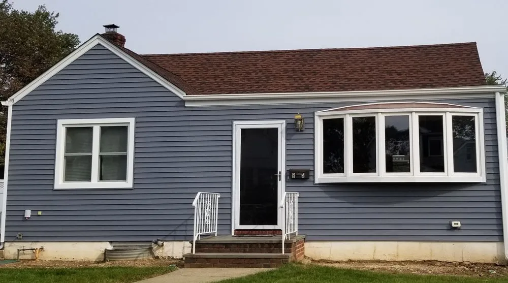 Slide of The Vinyl Siding Guys