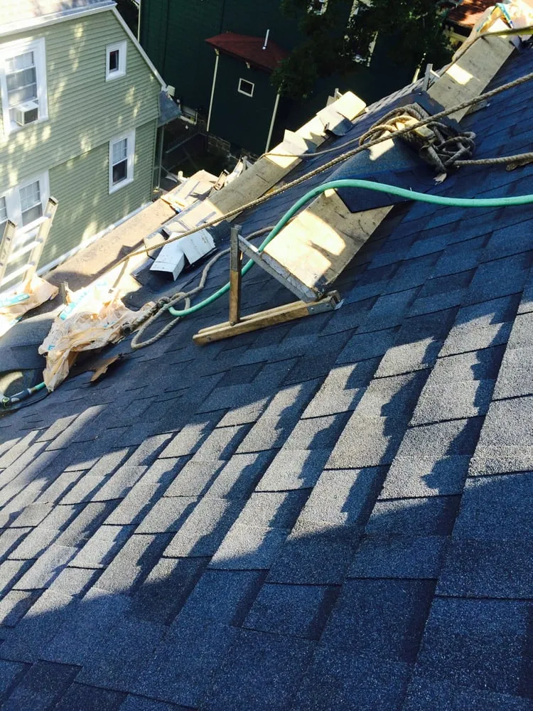 Slide of Thomas Burke Roofing & Gutters