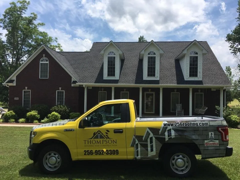Slide of Thompson Roofing and Construction